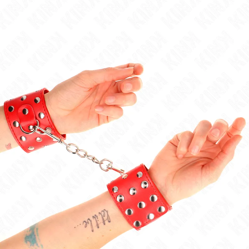 Kink - Wrist Restraints With Snap Fasten Full Of Rivets Red Adjustable 19-24 Cm X 5.5 Cm